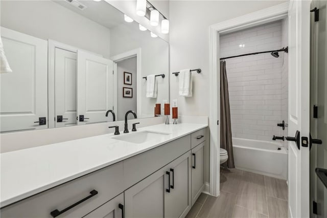 408 Townly Ct, Alpharetta, GA 30009 - bathroom featuring toilet, vanity, and shower / tub combo