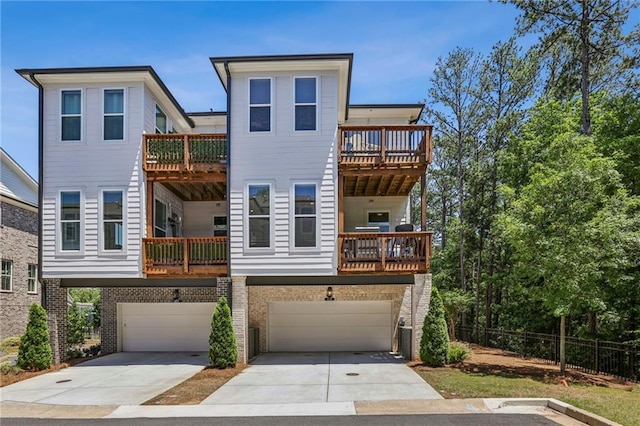 408 Townly Ct, Alpharetta, GA 30009 - view of front of house with driveway, a garage, a balcony, and brick siding