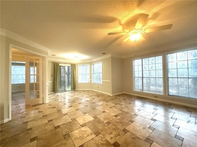 unfurnished room with crown molding, a textured ceiling, baseboards, and ceiling fan