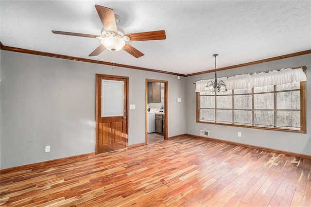 unfurnished room featuring light wood-type flooring, a textured ceiling, baseboards, and crown molding