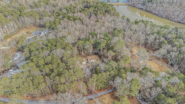 aerial view with a water view and a wooded view