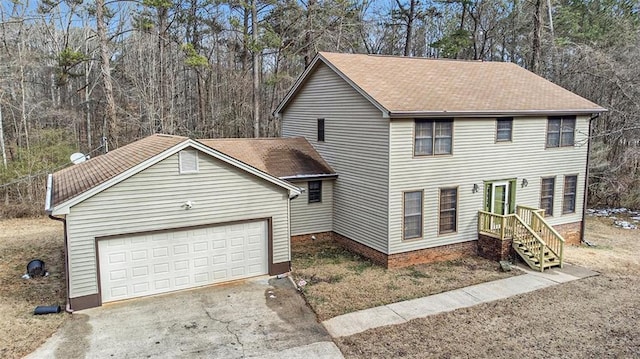 view of front facade featuring aphalt driveway and an attached garage