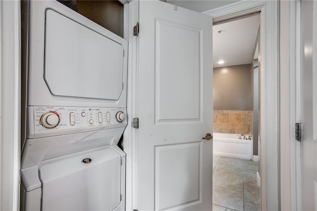laundry area with estacked washer and dryer