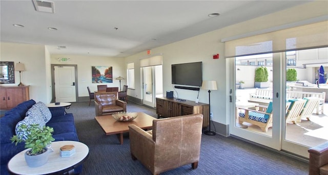 carpeted living room with recessed lighting