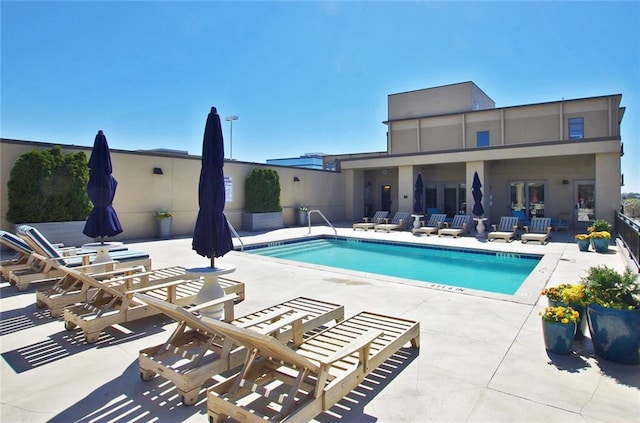 community pool with a patio