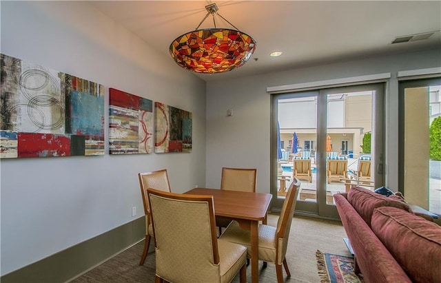 dining area with french doors and recessed lighting