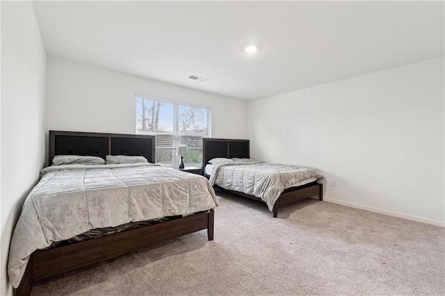 bedroom featuring light colored carpet