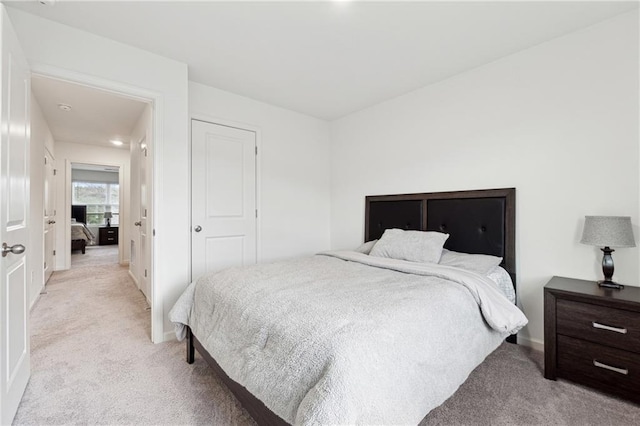 bedroom with light carpet