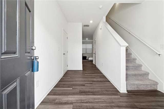 foyer entrance with dark hardwood / wood-style flooring