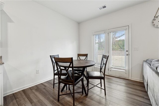 dining room with dark hardwood / wood-style floors