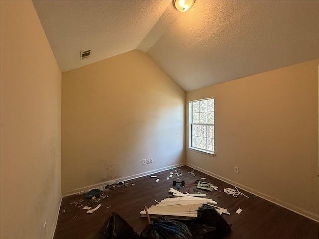 2625 Thunder Basin Way, Douglasville, GA 30135 - spare room featuring a textured ceiling, baseboards, vaulted ceiling, and visible vents