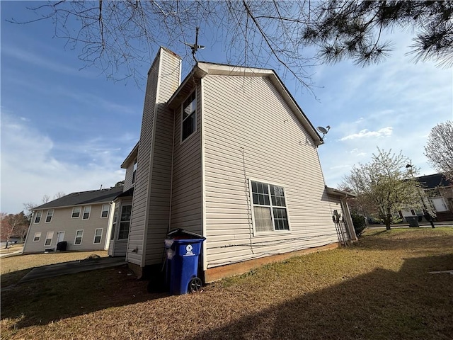 2625 Thunder Basin Way, Douglasville, GA 30135 - view of property exterior with a yard and a chimney