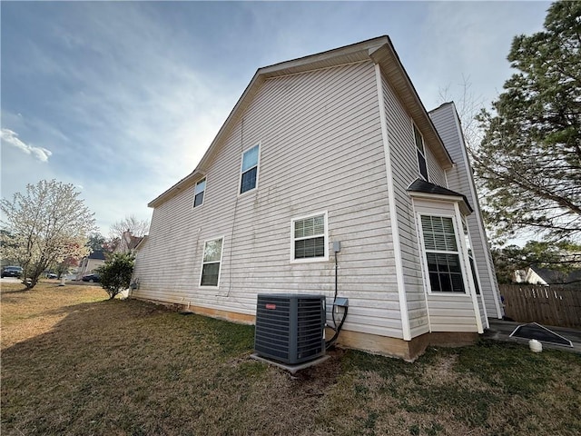 2625 Thunder Basin Way, Douglasville, GA 30135 - view of property exterior with cooling unit, fence, and a lawn