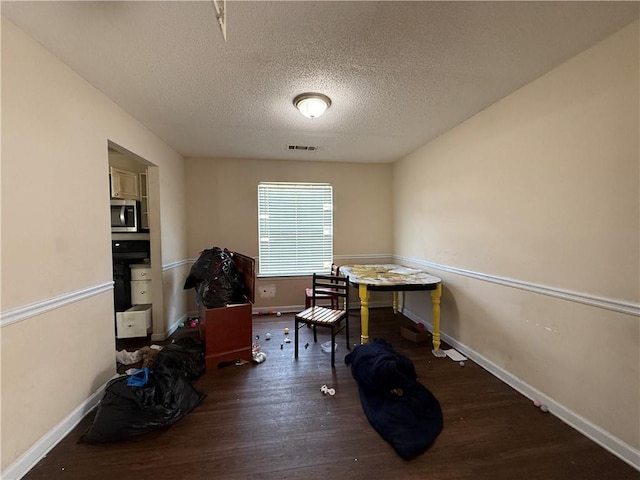 2625 Thunder Basin Way, Douglasville, GA 30135 - misc room with a textured ceiling, wood finished floors, baseboards, and visible vents