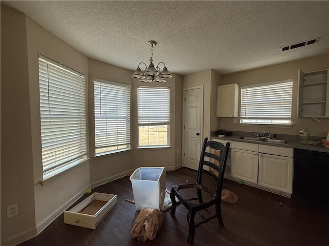 2625 Thunder Basin Way, Douglasville, GA 30135 - dining space featuring a textured ceiling, visible vents, a chandelier, dark wood-style flooring, and baseboards