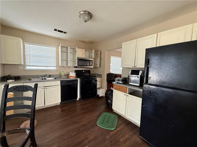 2625 Thunder Basin Way, Douglasville, GA 30135 - kitchen featuring open shelves, a textured ceiling, dark wood-style floors, white cabinetry, and black appliances