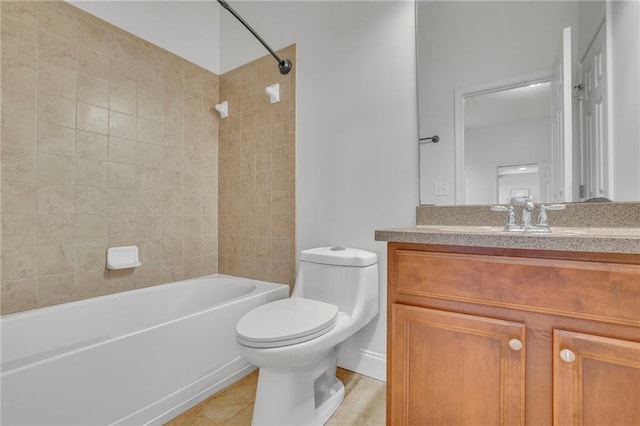 bathroom featuring toilet, tile patterned flooring, vanity, and bathing tub / shower combination