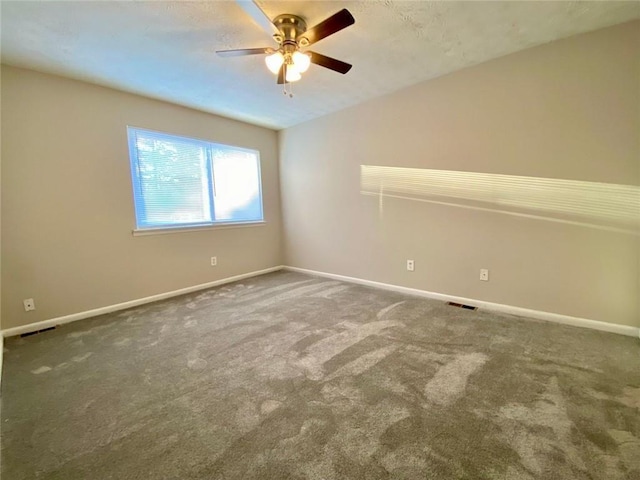 unfurnished room with vaulted ceiling, carpet flooring, and ceiling fan