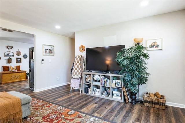 living room featuring dark hardwood / wood-style flooring