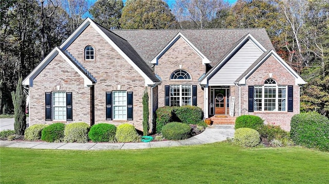 view of front of house with a front lawn