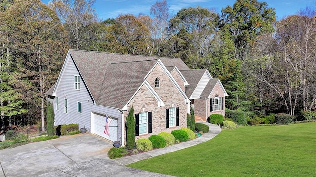 view of front of property with a garage and a front lawn