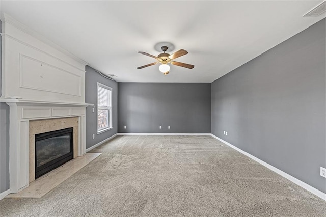 unfurnished living room with light carpet, a fireplace, visible vents, and baseboards