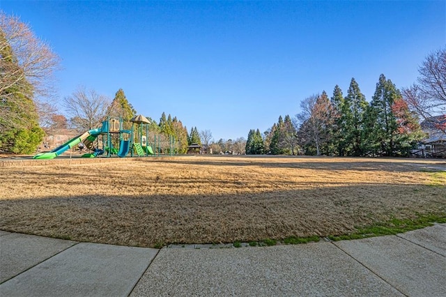 community jungle gym with a lawn