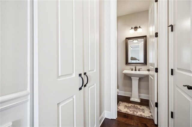 4155 Brookview Dr, Cumming, GA 30040 - half bath with wood finished floors, baseboards, toilet, and a sink