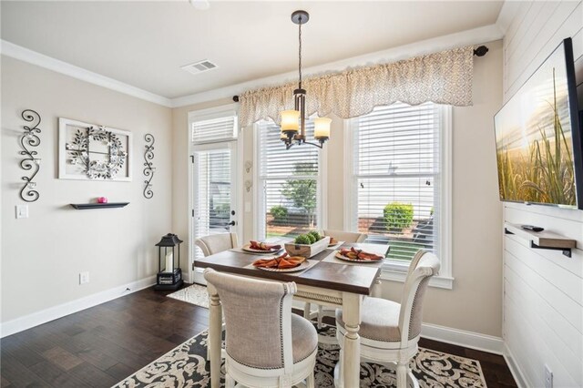 4155 Brookview Dr, Cumming, GA 30040 - dining area with a chandelier, dark wood-type flooring, baseboards, and ornamental molding