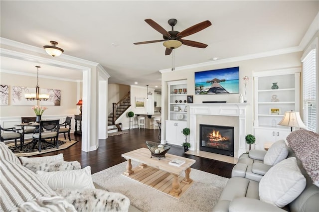 4155 Brookview Dr, Cumming, GA 30040 - living room with stairs, crown molding, a ceiling fan, a fireplace with flush hearth, and wood finished floors