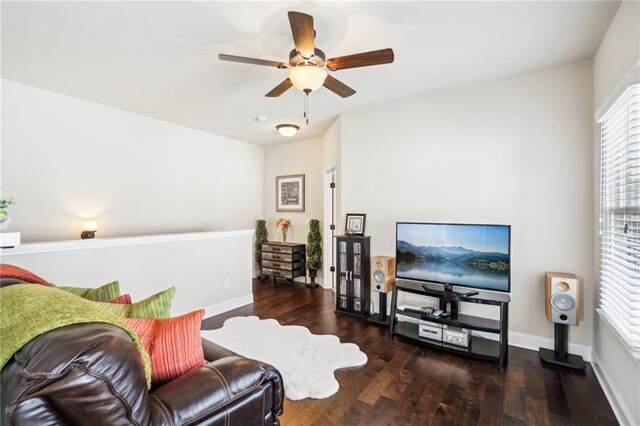 4155 Brookview Dr, Cumming, GA 30040 - living room with healthy amount of natural light, wood finished floors, ceiling fan, and baseboards