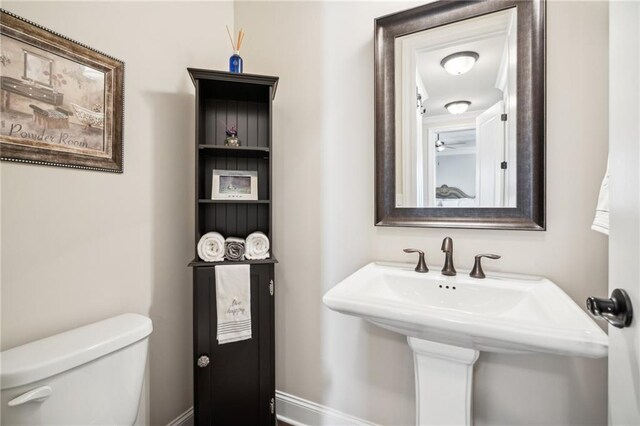 4155 Brookview Dr, Cumming, GA 30040 - bathroom featuring toilet, a sink, and baseboards