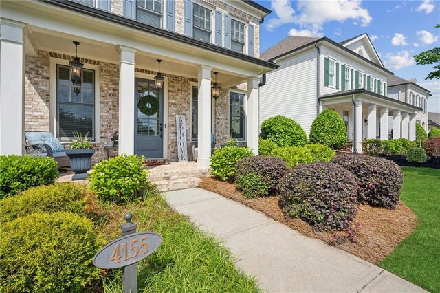 4155 Brookview Dr, Cumming, GA 30040 - doorway to property featuring a porch