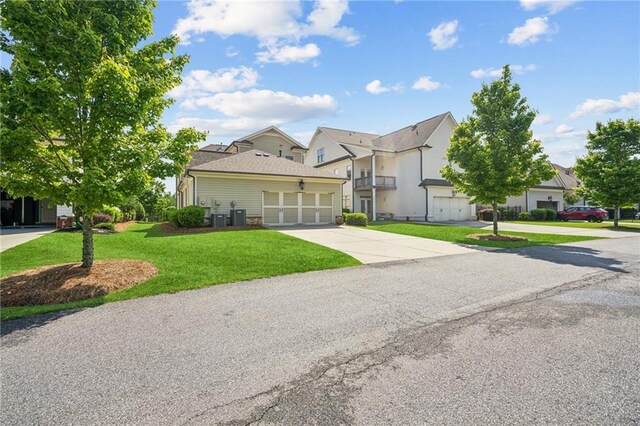 4155 Brookview Dr, Cumming, GA 30040 - view of front of house with an attached garage, driveway, and a front yard