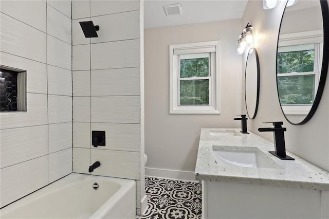 full bathroom with baseboards, a sink, and a wealth of natural light