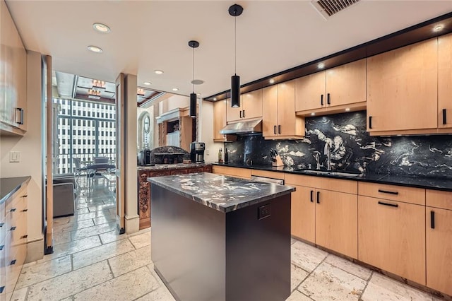 147 15th St NE Unit 16C, Atlanta, GA 30309 - kitchen featuring light brown cabinetry, backsplash, visible vents, and stone tile flooring