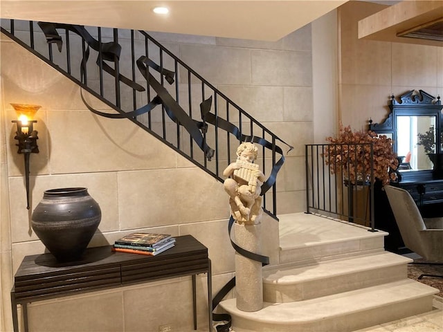 147 15th St NE Unit 16C, Atlanta, GA 30309 - stairway featuring tile walls
