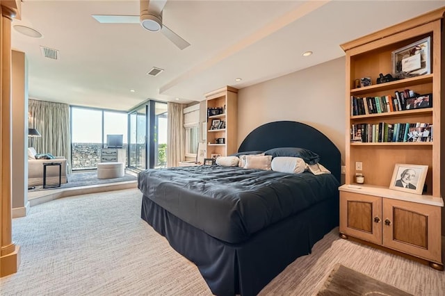 147 15th St NE Unit 16C, Atlanta, GA 30309 - bedroom with access to outside, light colored carpet, expansive windows, and visible vents