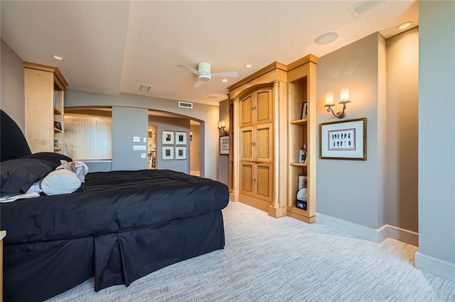 147 15th St NE Unit 16C, Atlanta, GA 30309 - bedroom with visible vents, light colored carpet, arched walkways, baseboards, and recessed lighting