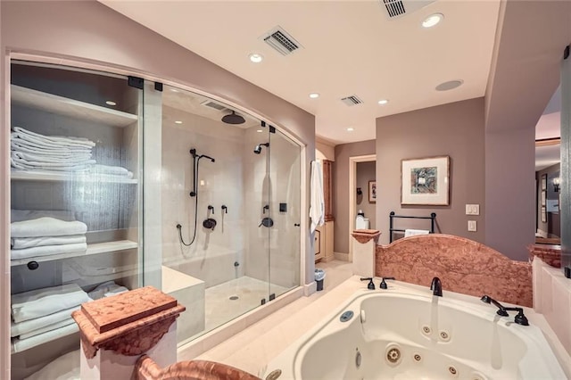 147 15th St NE Unit 16C, Atlanta, GA 30309 - bathroom with a whirlpool tub, visible vents, and a stall shower
