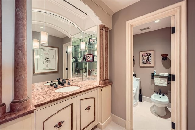 147 15th St NE Unit 16C, Atlanta, GA 30309 - bathroom with a bidet, visible vents, baseboards, vanity, and toilet