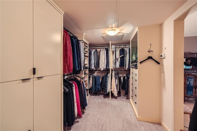 147 15th St NE Unit 16C, Atlanta, GA 30309 - walk in closet featuring carpet floors, attic access, and visible vents