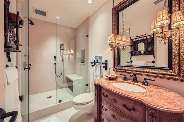 147 15th St NE Unit 16C, Atlanta, GA 30309 - bathroom with visible vents, an inviting chandelier, vanity, toilet, and a shower stall