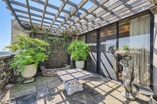 147 15th St NE Unit 16C, Atlanta, GA 30309 - view of patio / terrace with a pergola