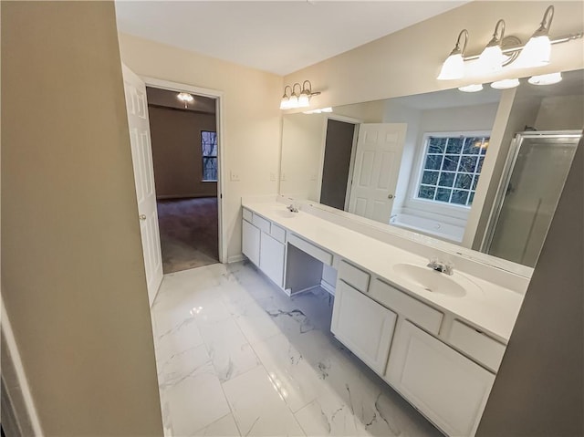 full bathroom with marble finish floor, a garden tub, double vanity, a sink, and a shower stall