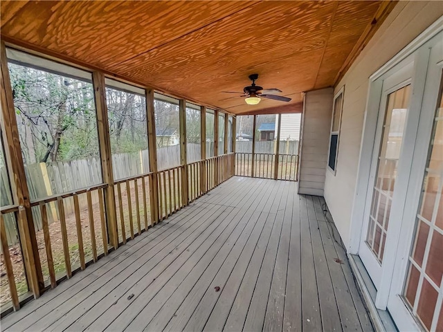 unfurnished sunroom featuring ceiling fan and wood ceiling