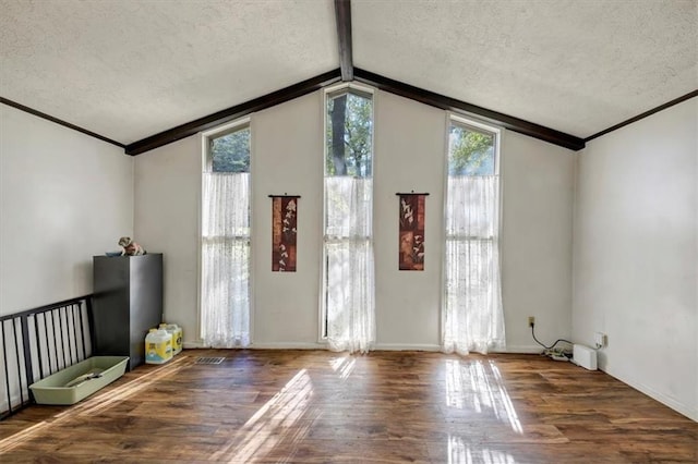 interior space featuring wood-type flooring, a textured ceiling, and vaulted ceiling