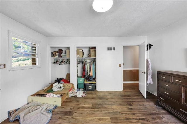 bedroom featuring dark hardwood / wood-style flooring