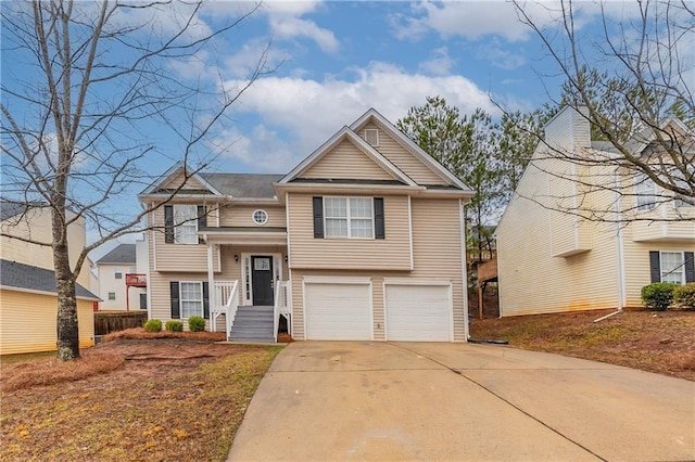 raised ranch with a garage and driveway