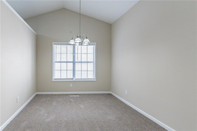 empty room featuring carpet floors, vaulted ceiling, baseboards, and an inviting chandelier